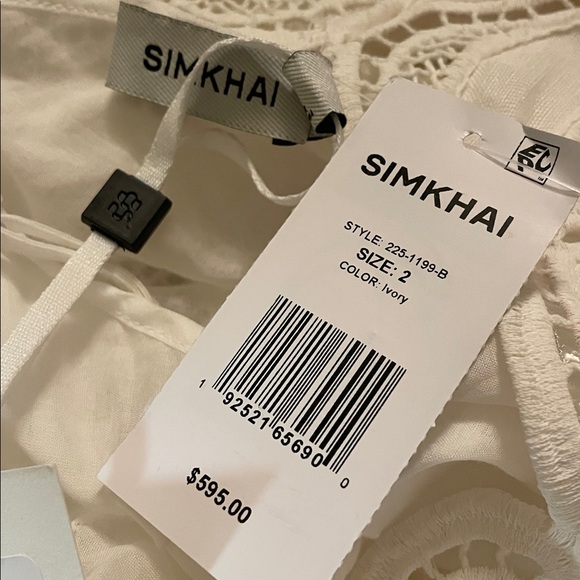 SIMKHAI Ivory Morrigan Short Sleeve Mini Dress. Models is wearing size 2. - Picture 6 of 8